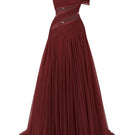 Le Thanh Hoa luminous flame gown featuring flowing fabric and intricate design, perfect for elegant evening occasions.