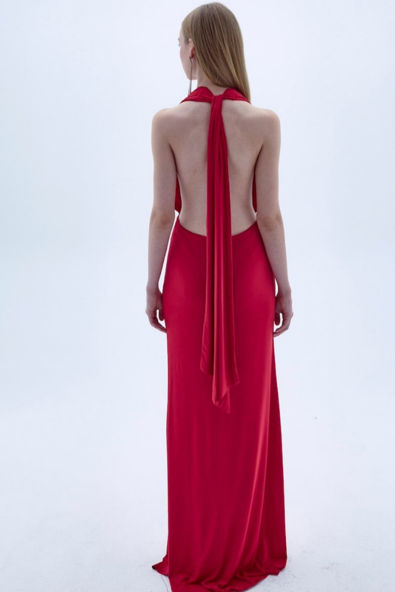 Red INES jersey long maxi dress by Nazlı Ceren, featuring a flowing fabric and elegant design, displayed on a hanger.