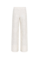 Cream Jora fringe trousers by Sélone, stylish pants with fringe detailing, showcased on a model against a neutral background.