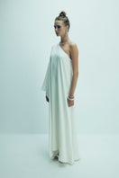 Nazlı Ceren Venus one-shoulder white maxi dress displayed on a model, flowing fabric and elegant design perfect for formal occasions.