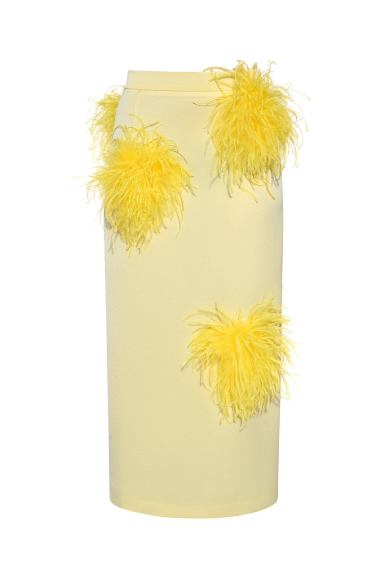 Lalo butter yellow midi pencil skirt with feather details, fitted design, and high waist, styled with a smooth fabric finish.