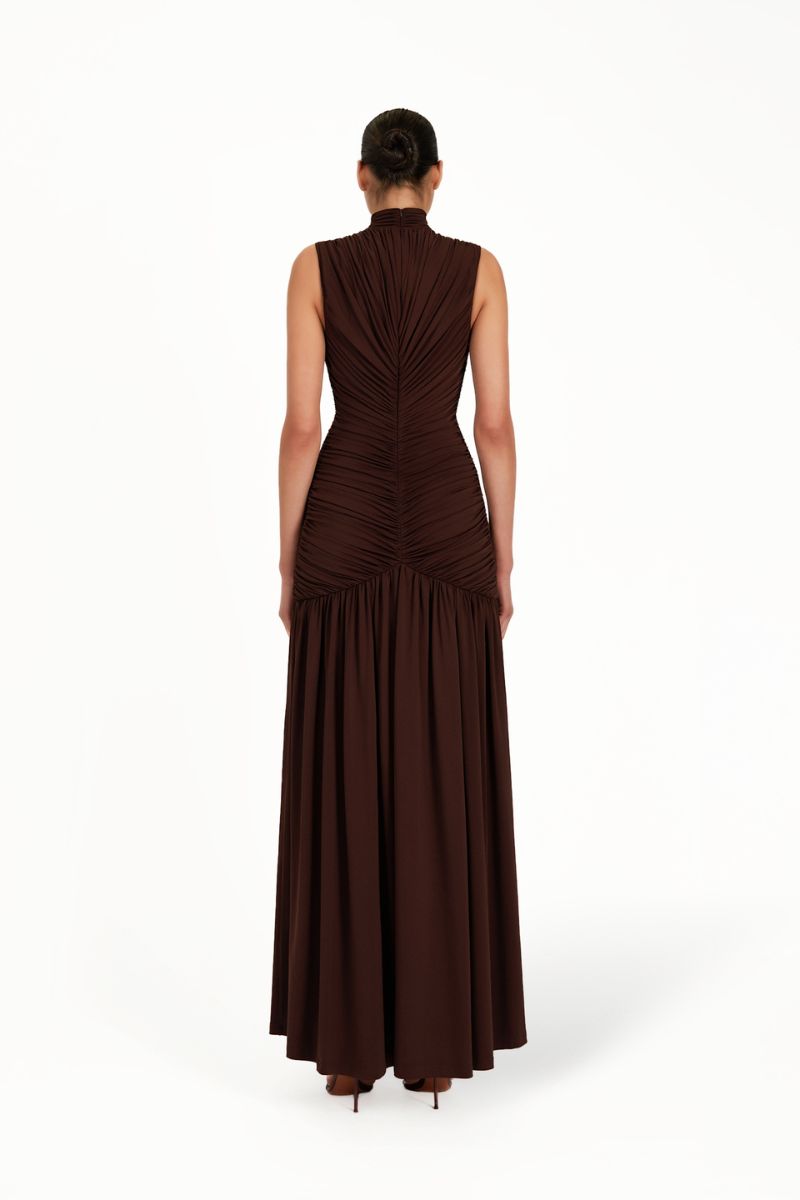 Khanum's brown maxi dress with flowing fabric and elegant design, perfect for casual or formal occasions.