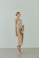 HACCHIC COUTURE Rosie Gold Pencil Midi Dress displayed on a mannequin, featuring a fitted silhouette and elegant gold color.