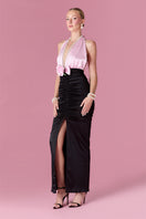 Elegant gold-toned gown from Nur Karaata's Gilded Society collection, featuring intricate detailing and flowing fabric.