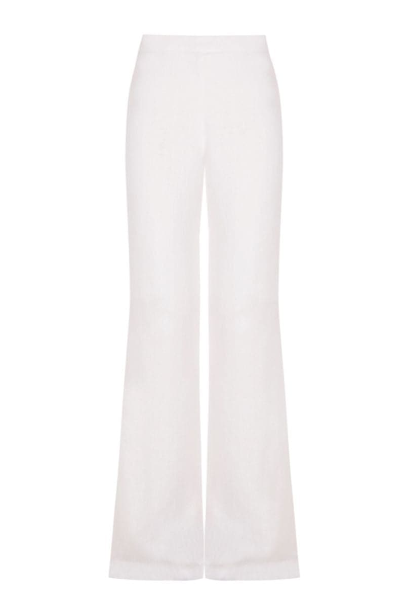White organic linen flared pants by JC Pajares, showing a flowy, wide-leg design with a comfortable fit.