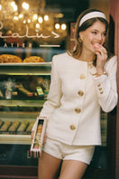 Nana Jacqueline Lisette White Retro Blazer shown on a hanger, featuring a tailored fit and vintage-inspired design in white fabric.