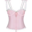 Light pink cake bustier top by Stolen Stores, featuring a fitted design and stylish details, perfect for trendy fashion looks.