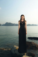 Lune De Soie black Lycra taffeta gown showing elegant fitted silhouette and flowing fabric for formal occasions.
