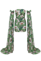 Nur Karaata Poppy Reverie mini dress featuring a floral pattern, sleeveless design, and flowing fabric.