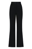 Lili Blanc black wide-leg trousers with a relaxed fit and high waist, displayed on a model.