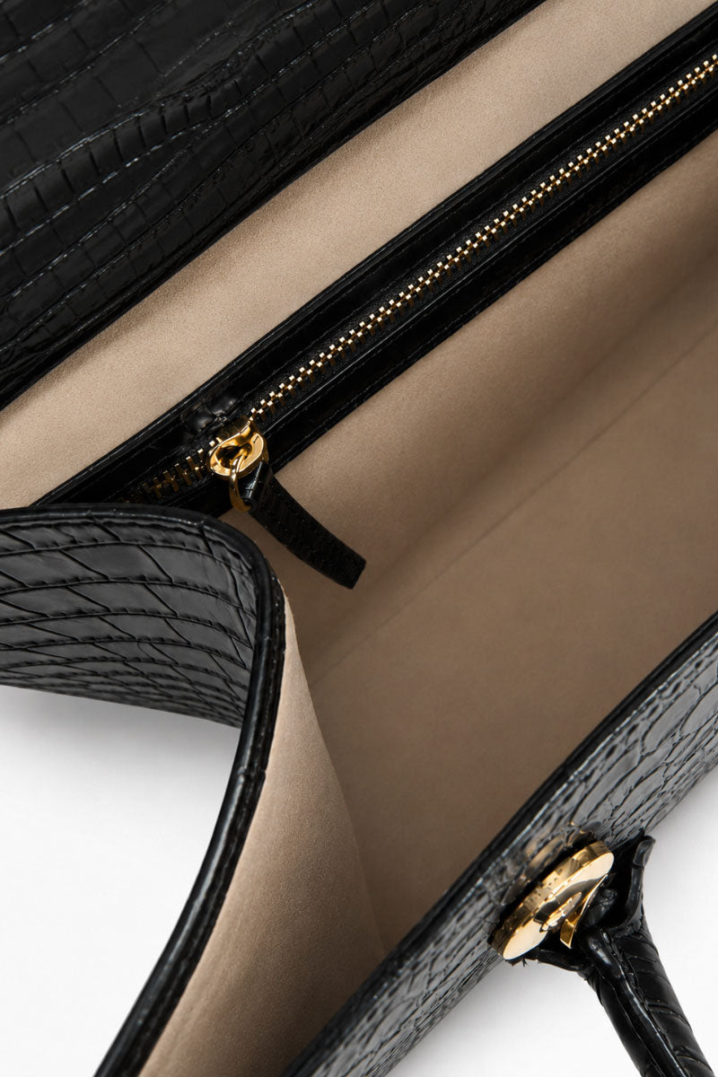 Black CELINE shoulder bag by VIKELE STUDIO with sleek design and structured shape, displayed on a plain background.