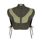 Ana + Maria Vivra bib top in lichen green and sage green, showing a stylish sleeveless blouse with a relaxed fit.