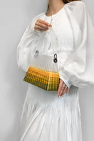 Touchless CULT MIA X green and yellow pleated ombre top handle handbag with touchless design and elegant pleats.
