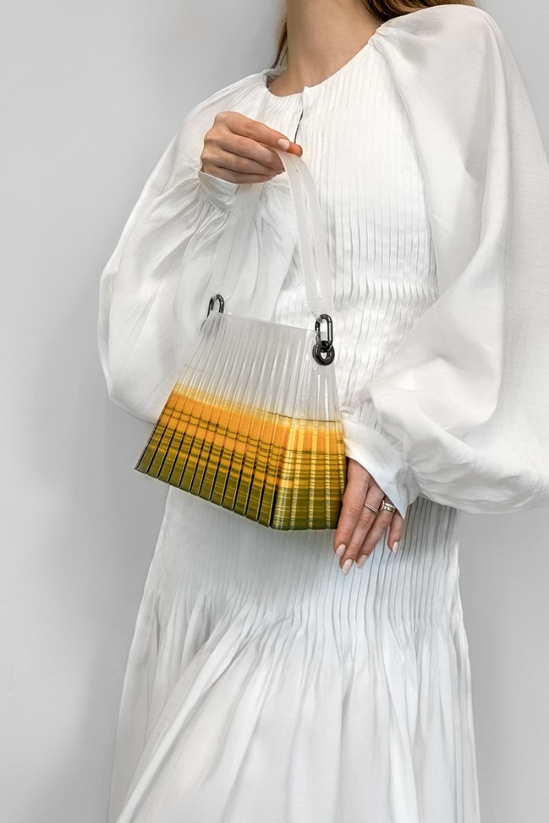 Touchless CULT MIA X green and yellow pleated ombre top handle handbag with touchless design and elegant pleats.