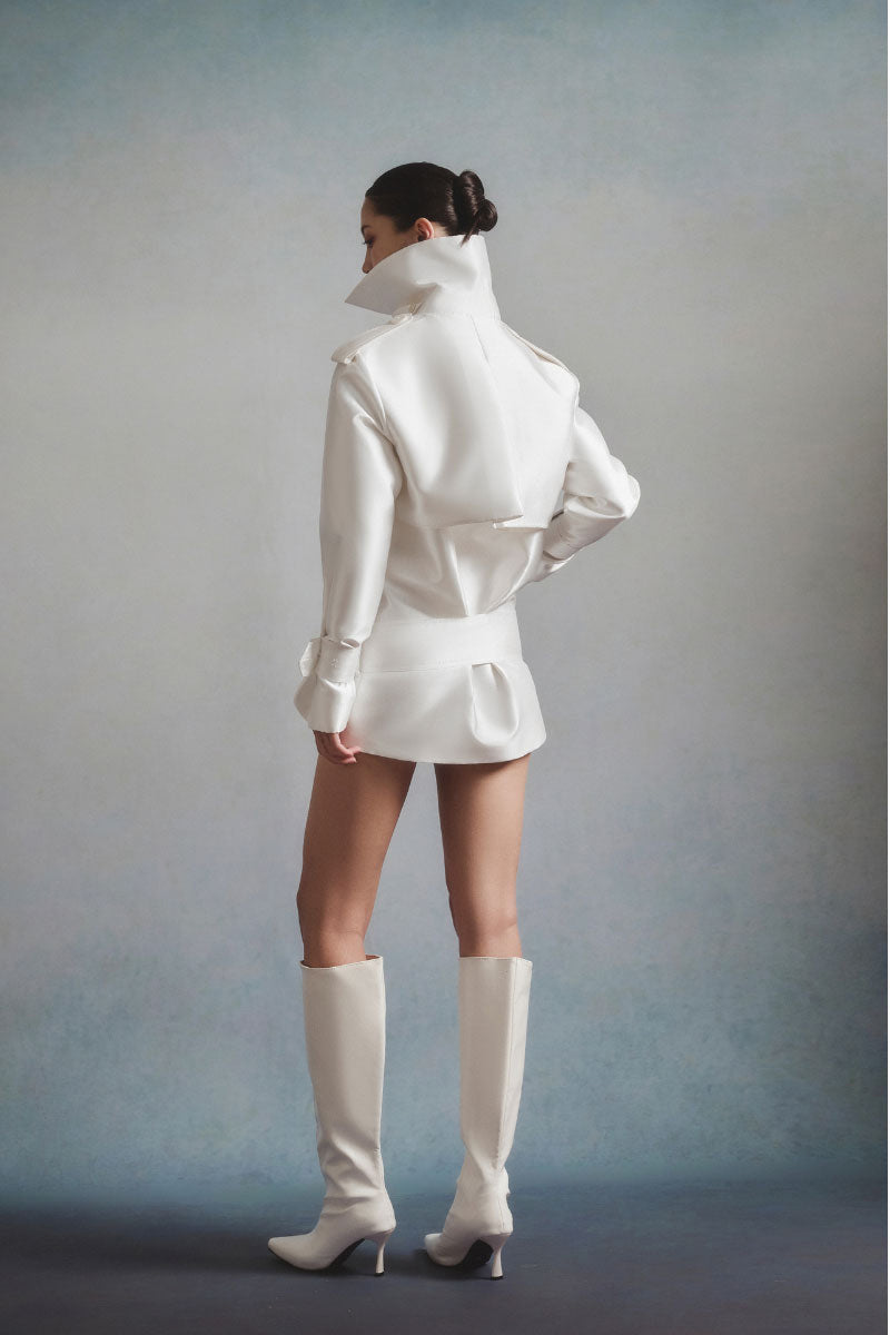 White Plan Aurora Sculpted Jacket featuring a fitted design and sleek silhouette, displayed on a hanger against a neutral background.