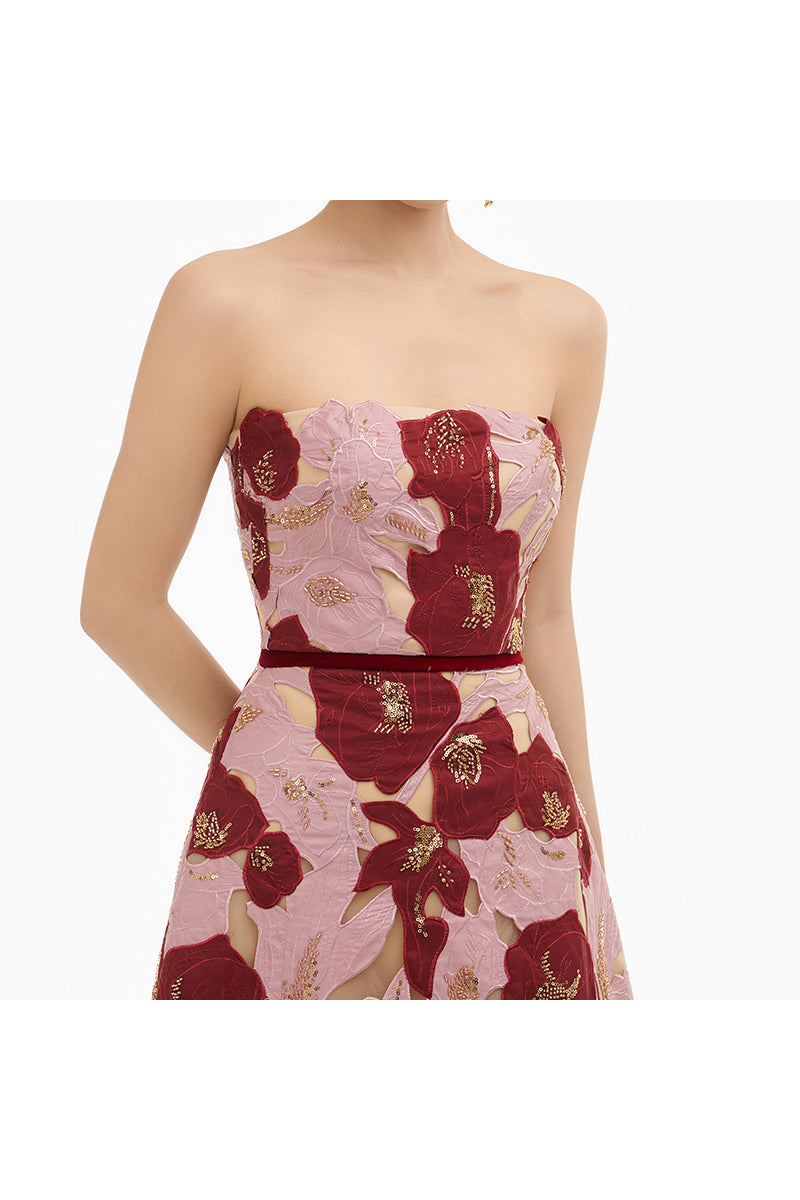 Elegant rose petal strapless gown by Happy Clothing, featuring a flowing skirt and delicate floral details in soft pink.