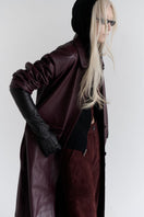 ZUT Palermo leather coat shown on a hanger, featuring a sleek black design with classic collar and button closure.