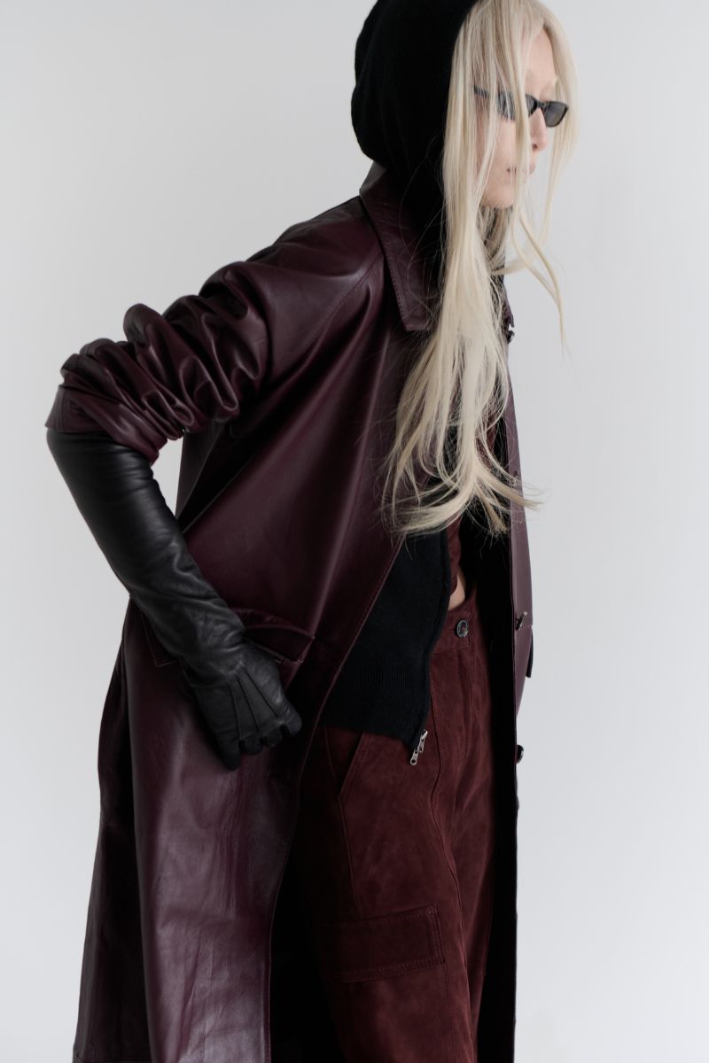 ZUT Palermo leather coat shown on a hanger, featuring a sleek black design with classic collar and button closure.