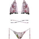 Nur Karaata Sunset Palms Bikini featuring a colorful tropical print and stylish bikini top and bottom ensemble.