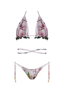Nur Karaata Sunset Palms Bikini featuring a colorful tropical print and stylish bikini top and bottom ensemble.