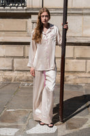 Blush pink silk long pajama set by Not Just Pajama featuring a comfortable top and matching pants from the Museum of Crush collection.