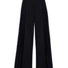 Black GVLUX multi-pleat wide-leg trousers with a relaxed fit and flowing silhouette, shown on a model.