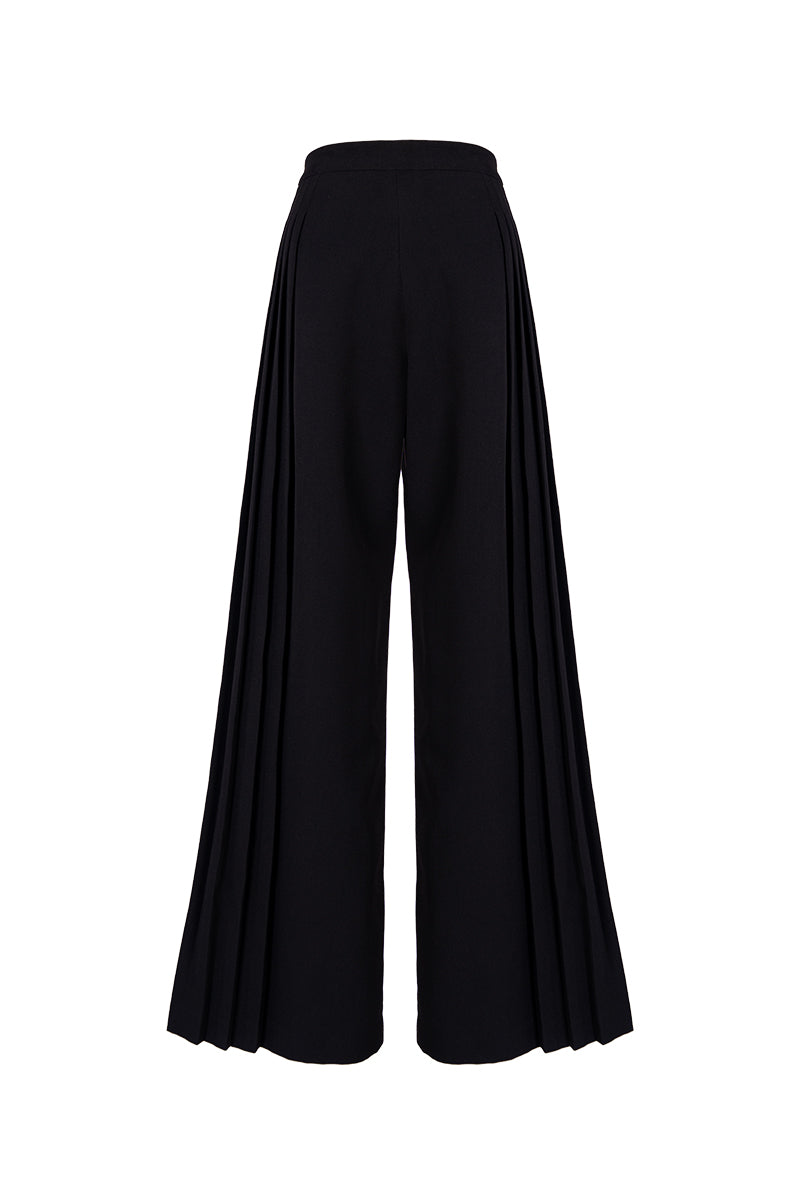 Black GVLUX multi-pleat wide-leg trousers, stylish pants with a relaxed fit and pleated design, shown on a model.