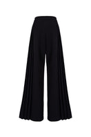 Black GVLUX multi-pleat wide-leg trousers with a relaxed fit, displayed on a hanger against a neutral background.