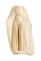 Deme By Gabriella Robin co-ord set in gold, featuring matching top and pants with stylish details and a sleek, modern design.
