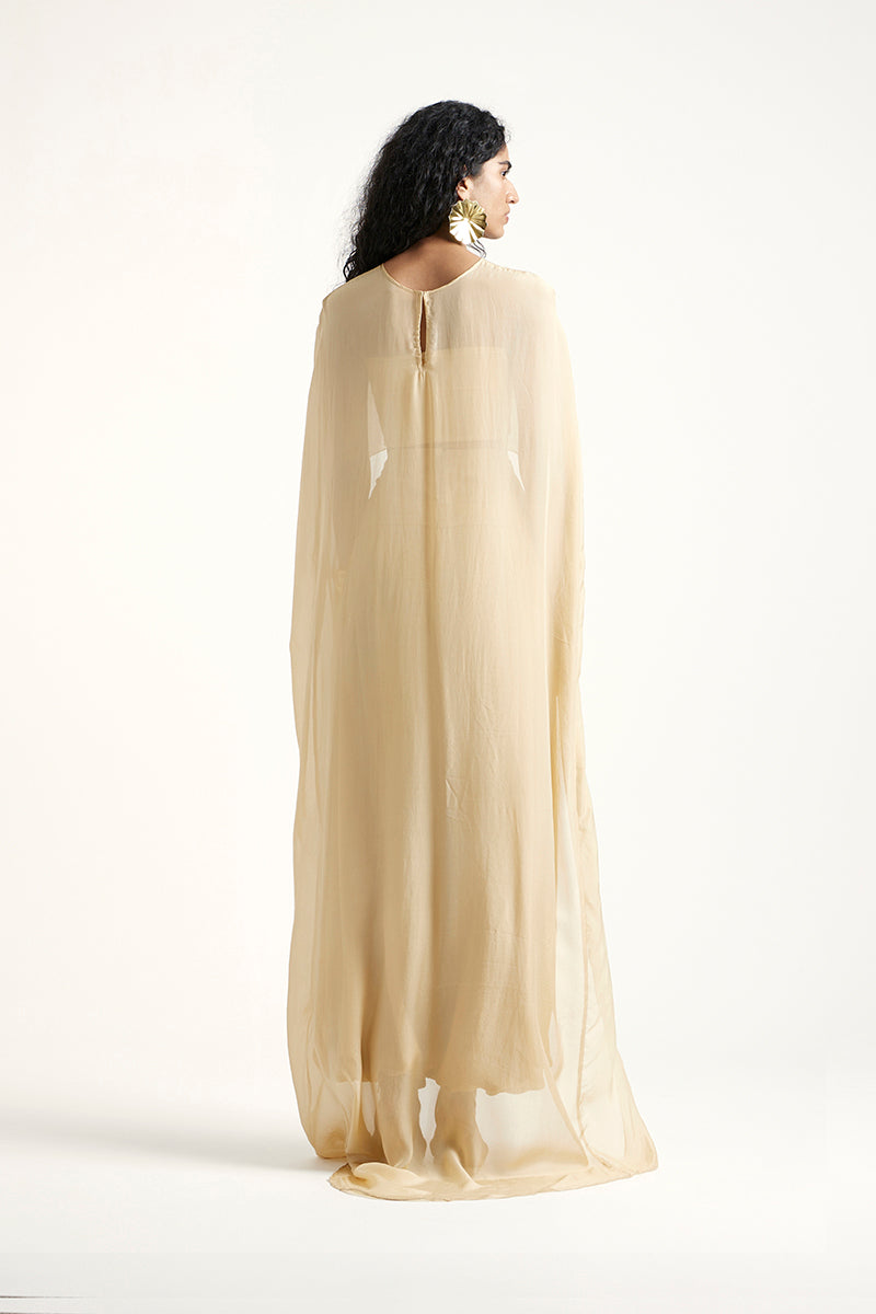 Deme By Gabriella Robin co-ord set in gold, featuring matching top and pants with stylish design and metallic finish.