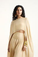 Deme By Gabriella Robin co-ord set in gold, featuring a stylish matching top and pants ensemble, on a neutral background.