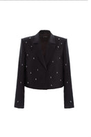 Black Shorten Jewelry Blazer by KRIS MARÁN, stylish women's jacket with a sleek design, shown on a model in the image.