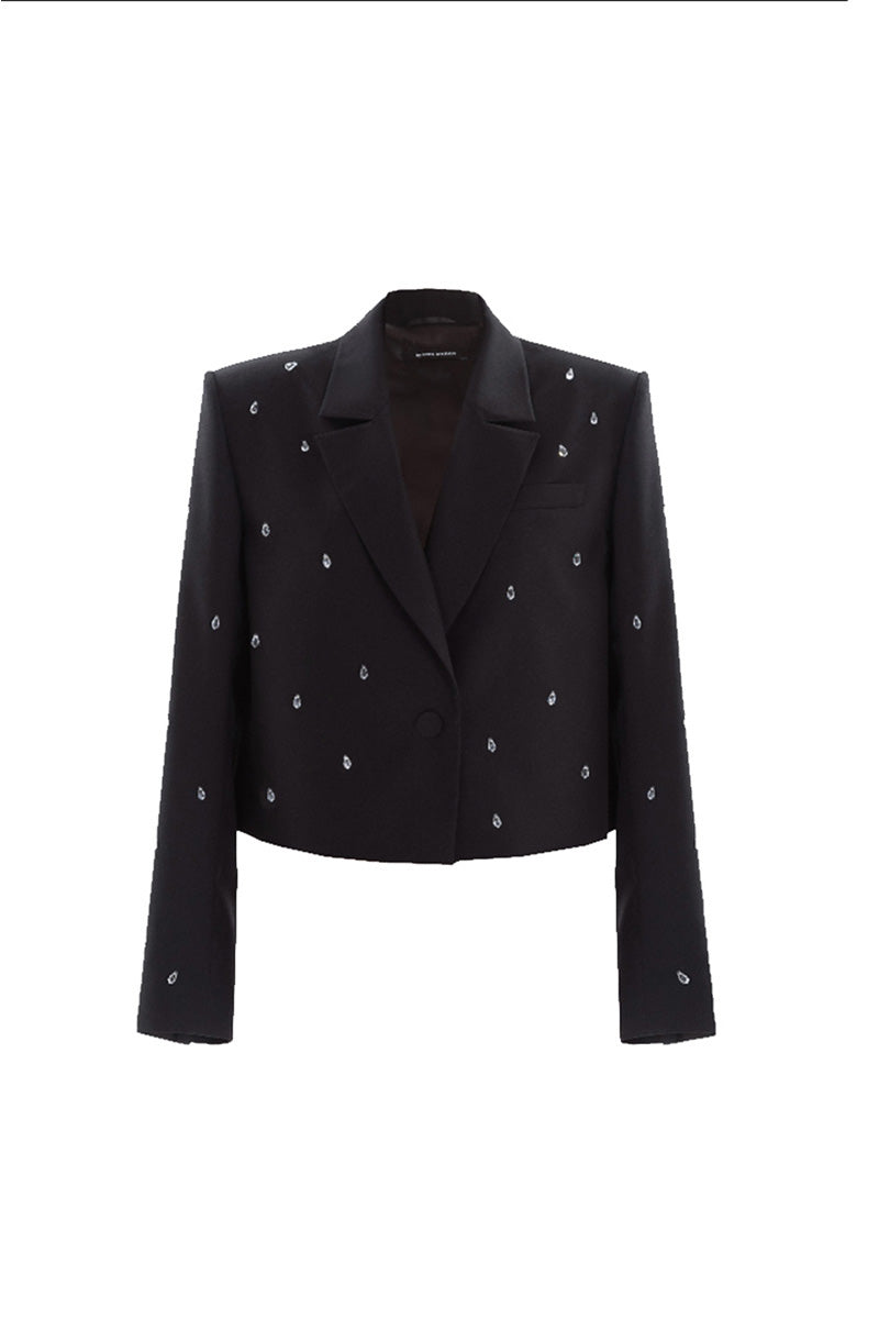 Black Shorten Jewelry Blazer by KRIS MARÁN, stylish women's jacket with a sleek design, shown on a model in the image.