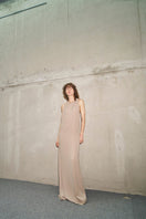 URA RYO moss maxi dress displayed on a model, featuring a flowing silhouette and elegant design for stylish summer wear.
