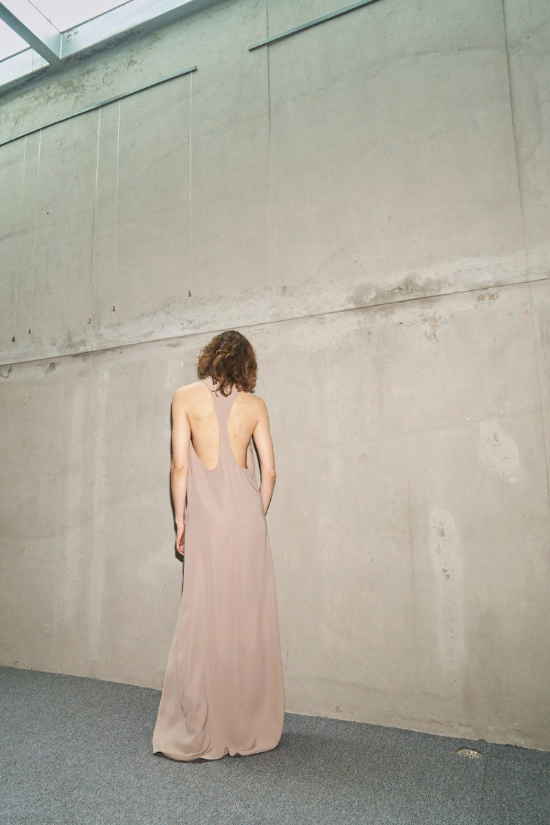 URA RYO Moss Maxi Dress featuring a flowing, sleeveless design in vibrant moss green fabric.