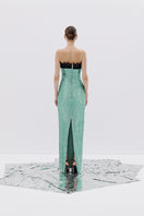 Mint green strapless maxi gown by Tayfun Kaba, flowing dress with elegant design and full-length silhouette.