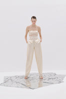 Cream sequin bandeau top by Tayfun Kaba, strapless with shiny sequins, perfect for stylish evening wear.