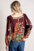 Raishma Harlow Top, stylish women's blouse with elegant design and comfortable fit, shown in a close-up of the front.