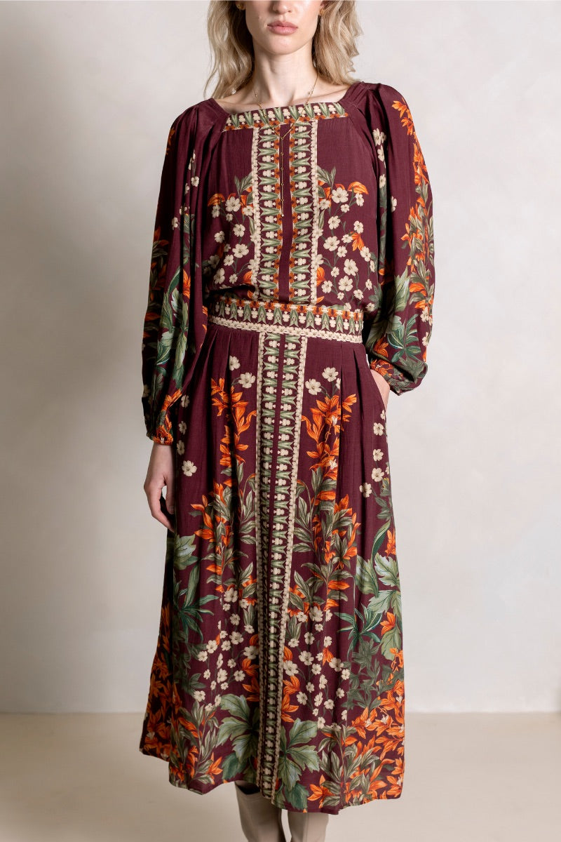 Raishma Harlow maxi skirt in flowing fabric with a fitted waistband and elegant length, perfect for stylish daytime wear.