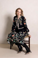 Raishma Maison Maxi Dress featuring elegant flowing fabric and a stylish neckline, perfect for formal occasions.