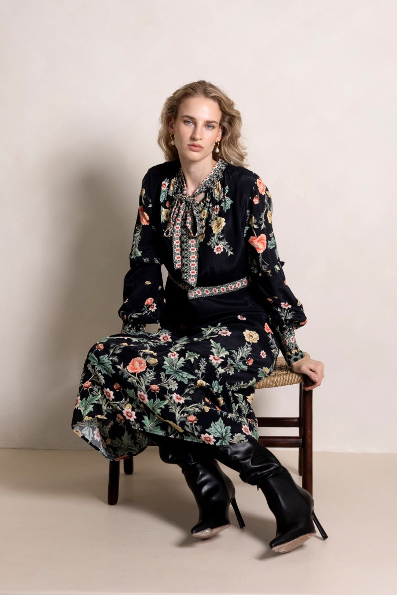 Raishma Maison Maxi Dress featuring elegant flowing fabric and a stylish neckline, perfect for formal occasions.