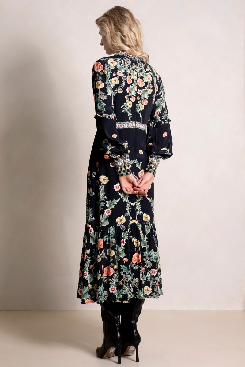 Raishma Maison Dress, a stylish maxi dress with elegant fabric and flowing design, showcased in a full-length image.