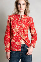 Raishma Esme red shirt displayed on a hanger, showcasing the stylish design and vibrant color of the women's shirt.