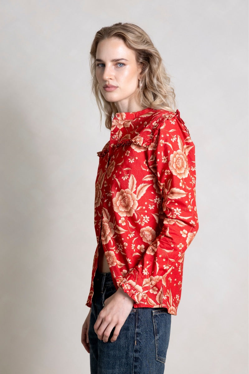 Raishma Esme red shirt displayed flat, showing its vibrant color, classic collar, and button details on a plain background.