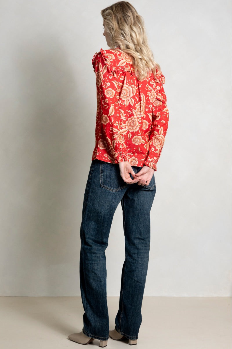 Red Raishma Esme shirt with long sleeves and a classic collar, displayed on a hanger.