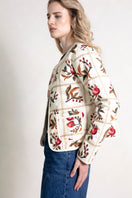 Raishma Demi Jacket, stylish women's jacket with tailored fit and modern design, shown in a fashionable outdoor setting.