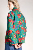 Raishma Willow jacket displayed on a hanger, showcasing its stylish design and fabric details.