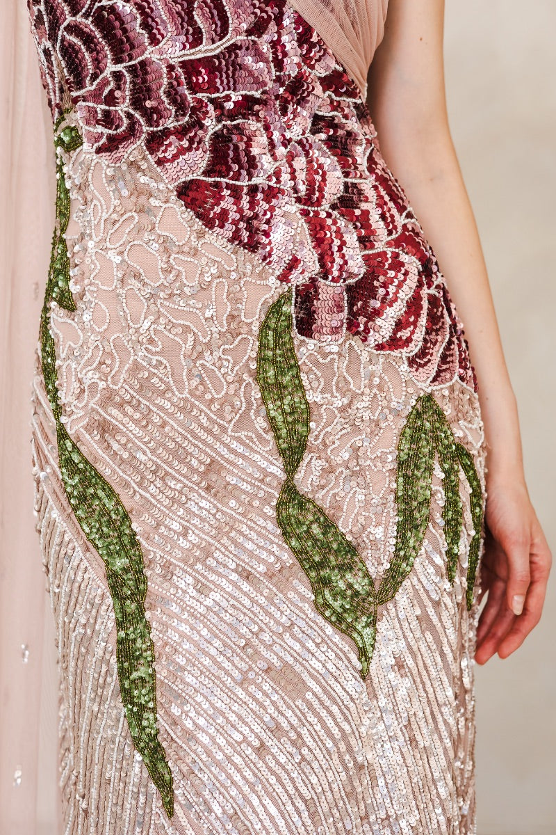 Raishma Natalia pink gown featuring elegant fabric, flowing design, and intricate details, perfect for formal occasions.
