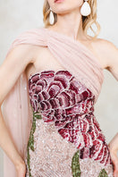 Pink Natalia gown by Raishma, elegant evening dress featuring flowing fabric and intricate detailing, displayed on a mannequin.