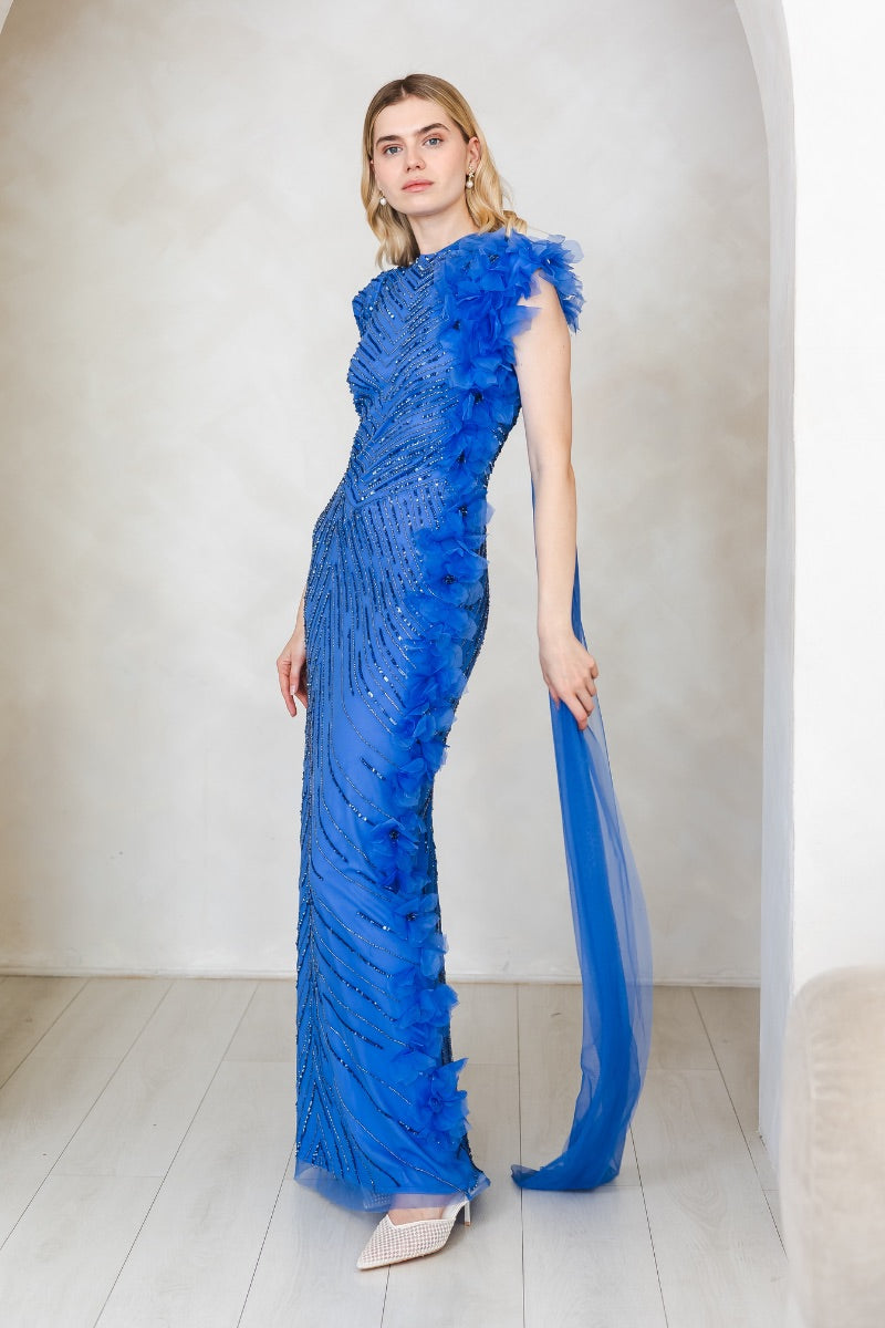 Elegant Camille cobalt gown by Raishma featuring flowing fabric and intricate design, displayed on a mannequin.